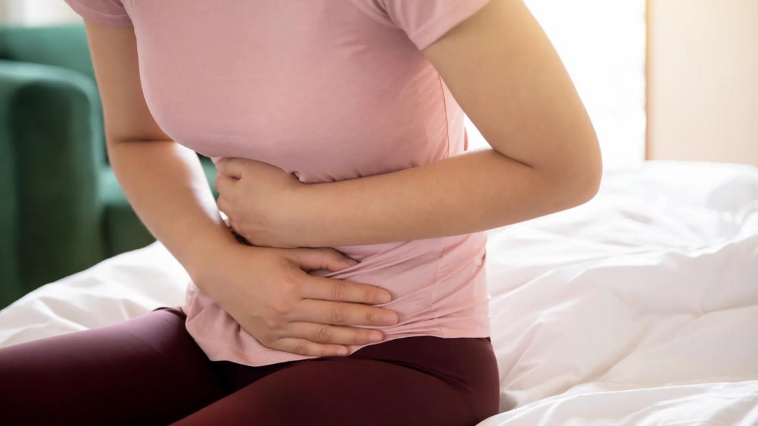 Patient holding stomach