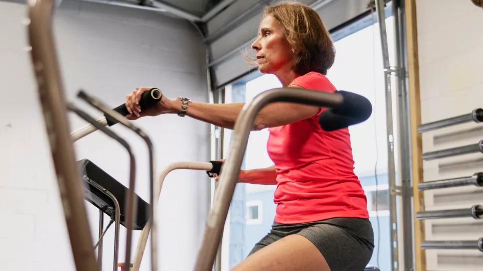 woman on stationary exercise cycle