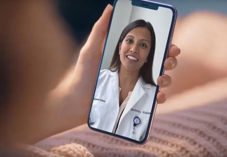 Patient during a virtual visit with her doctor via her smart phone.