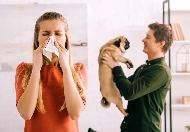Woman allergic to dog being held by man