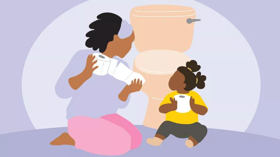 Caregiver and child sitting in front of toilet holding toilet paper rolls
