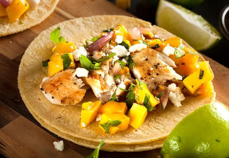 open-faced taco topped with grilled red snapper and mango salsa