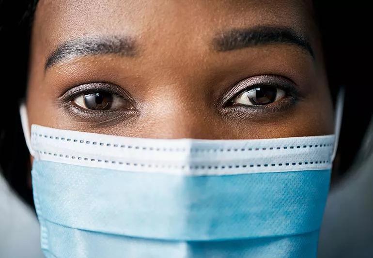 Close-up of woman wearing a surgical mask