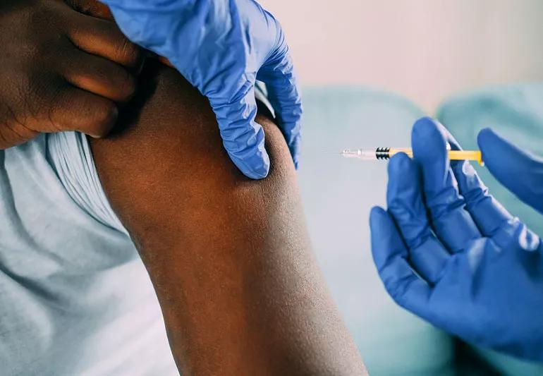 Closeup of person getting a flu shot.