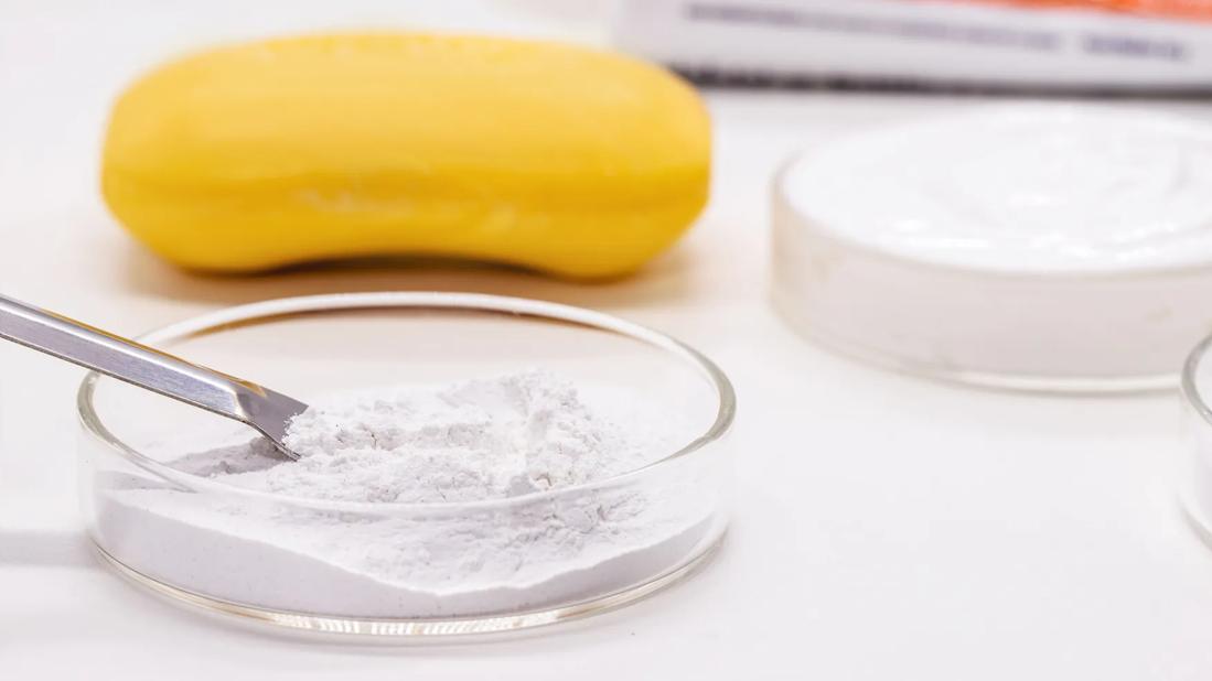 Different forms of soap, with a bar and powder