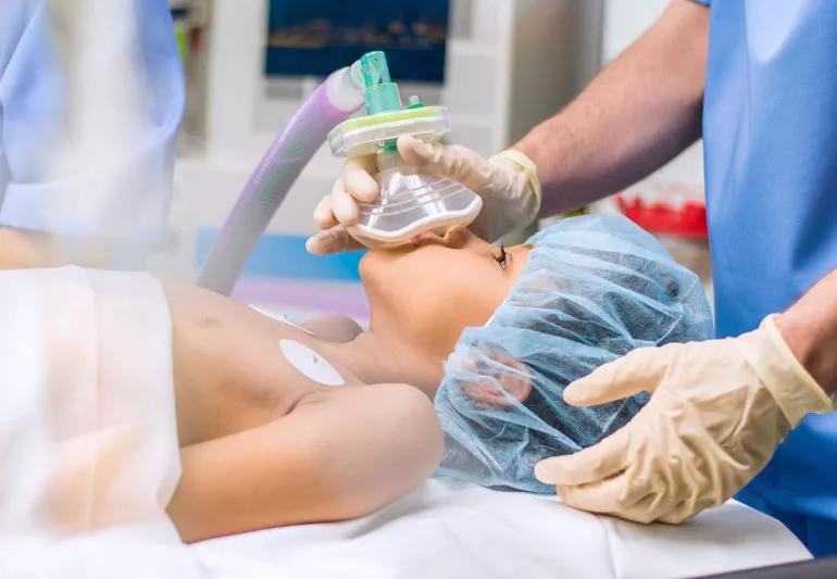 child undergoing anethesia in operating room