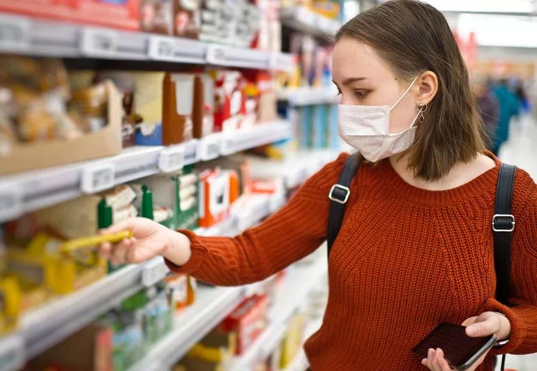 woman shopping for groceries during COVID-19