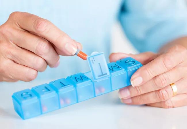 Person organizing medication