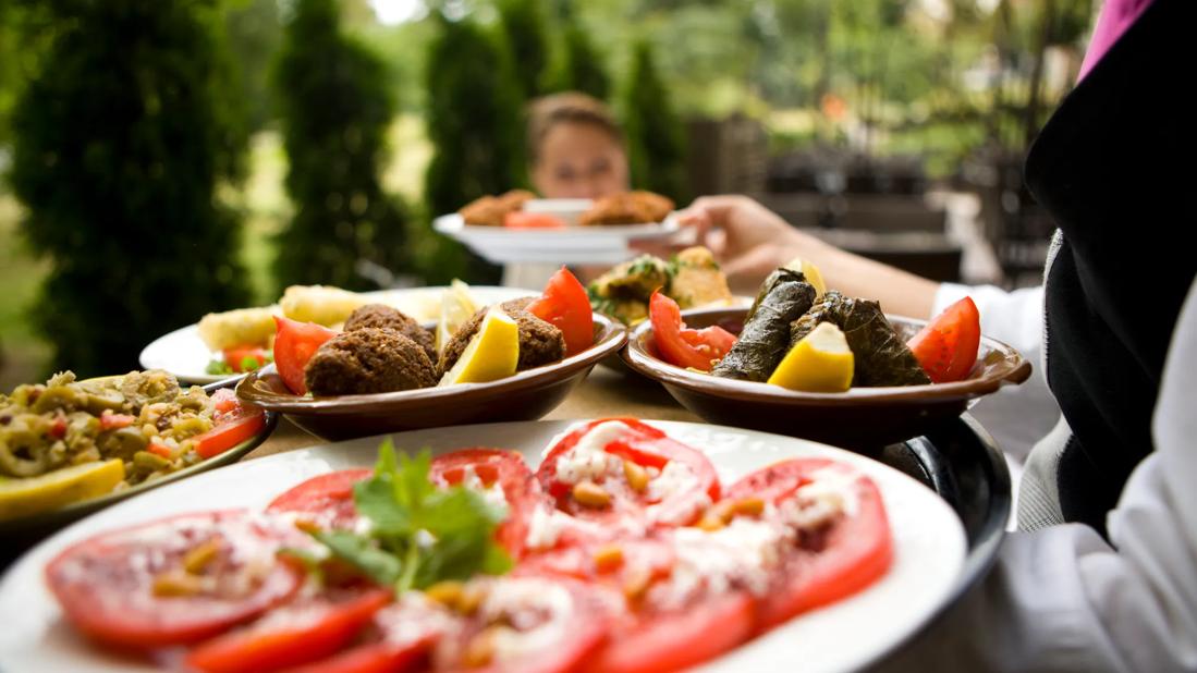 A server carries a platter full of nutritious foods