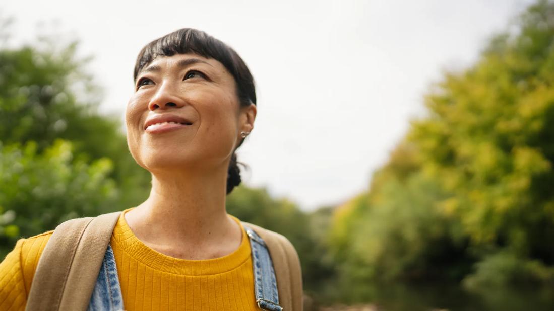 Happy person looking around while walking outside