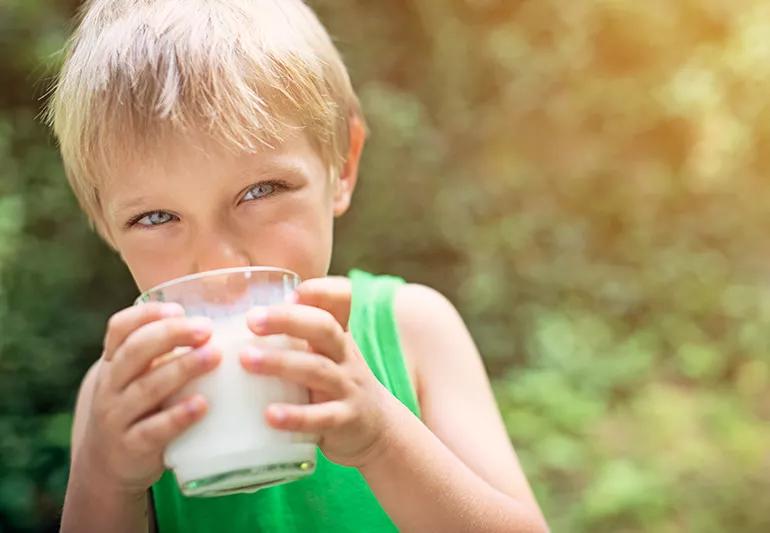 Little boy drinking milk