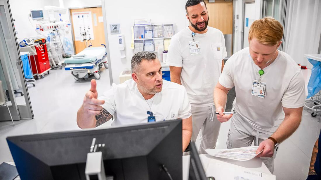 Caregivers having a discussion on a unit