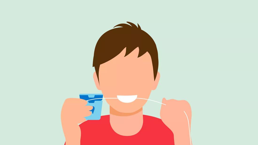 Person flossing their teeth.