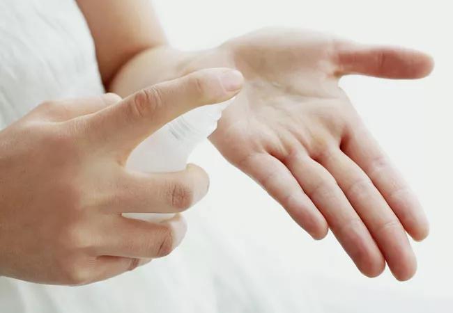 Woman dispensing hormone replacement gel