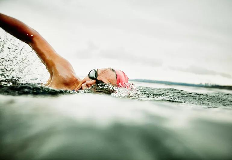 A person swimming in a lake.