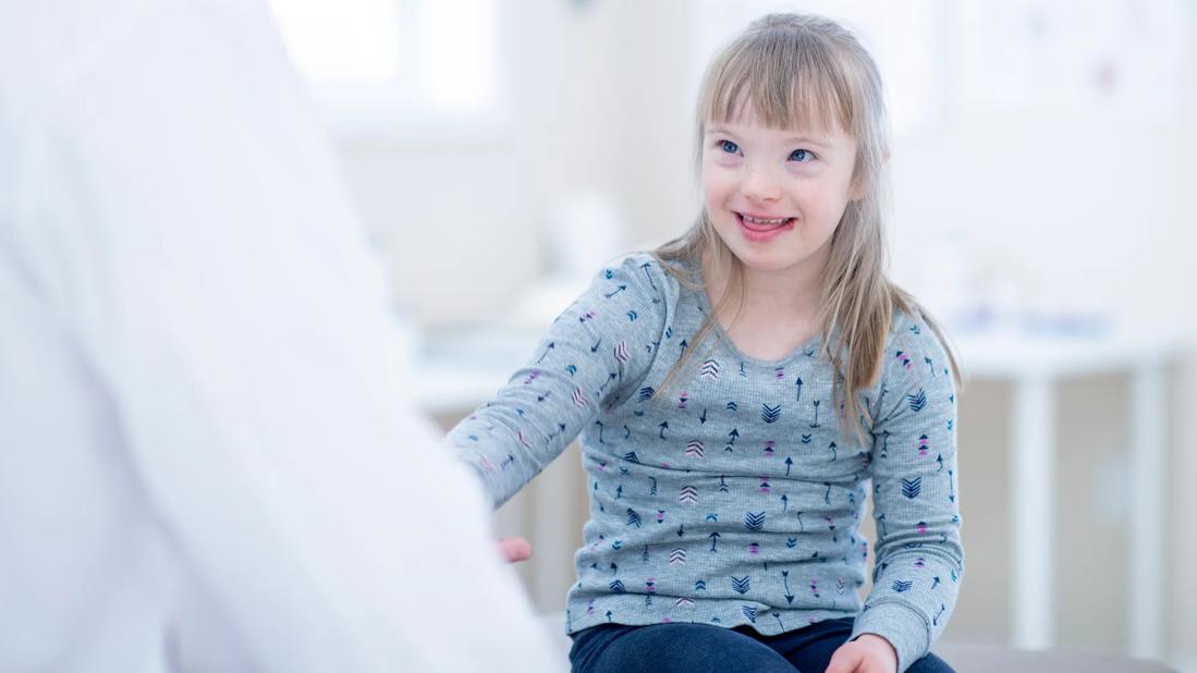 Doctor speaking with pediatric patient