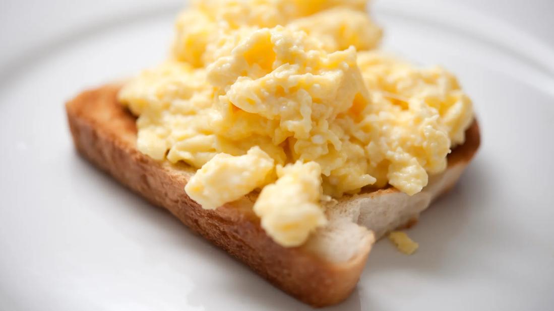 Plain scrambled eggs on a piece of toast