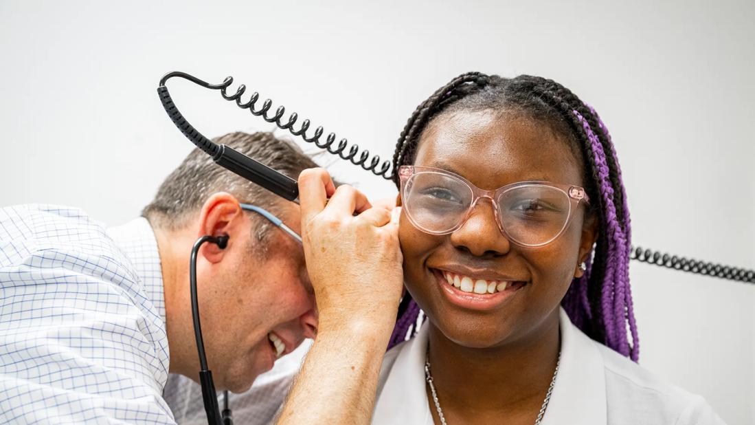 Teenager undergoing ear exam