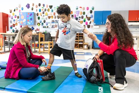 young boy in physical therapy