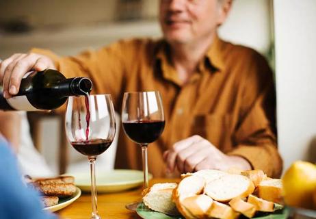 Man pouring wine.