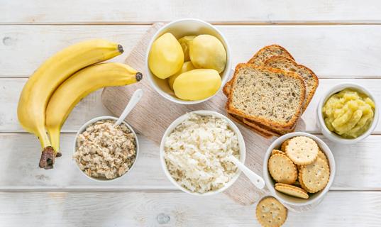 Foods found in a BRAT diet, like bananas, rice, toast and applesauce