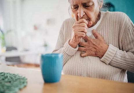 older adult coughing