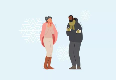 Two people standing in the cold.