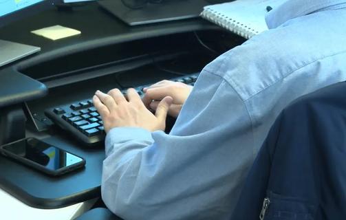 Person typing on keyboard