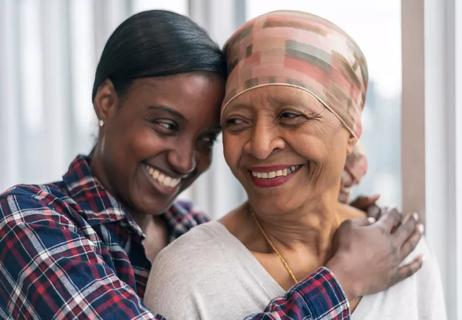 Cancer patient with her daughter offering support