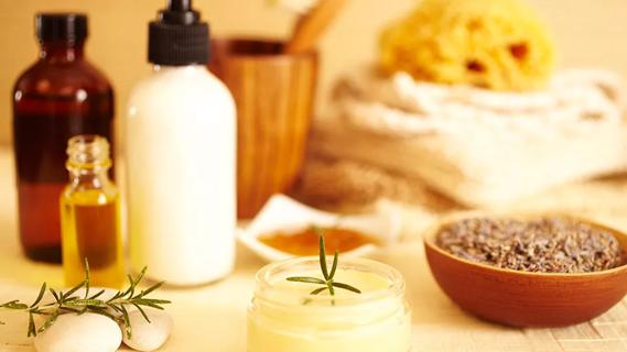 bottles and jars of natural lotions and essential oils
