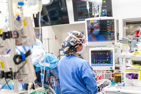 Nurse surrounded by monitors
