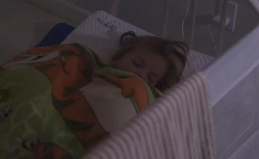 Child sleeping in bed