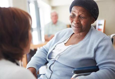 Patient in wheelchair, black woman