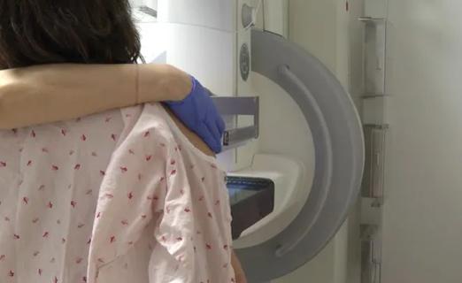 Woman getting mammogram