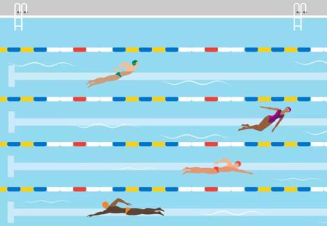 People swim laps in lanes at indoor pool.