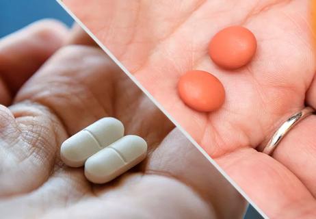 Hands holding two different kinds of pain medications separated by a white line.