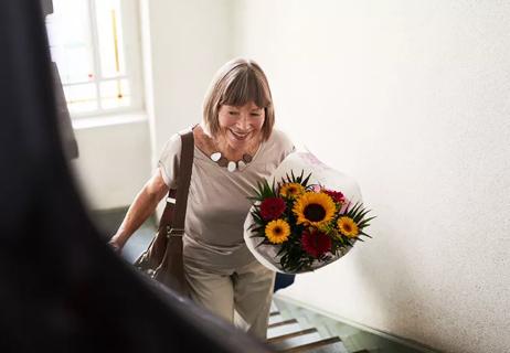 Woman walks upstairs