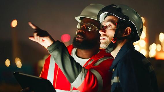 Two nightshift workers consulting