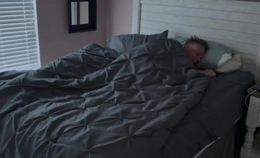 Person sleeping in bed