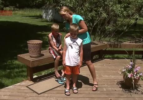 Mom checking child for ticks