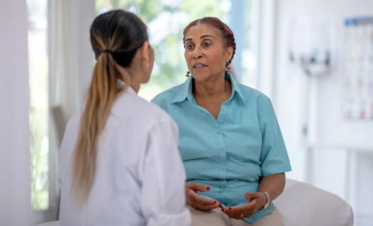 Older patient talking with healthcare provider
