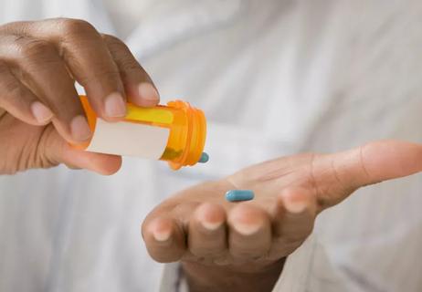 man taking heart medication
