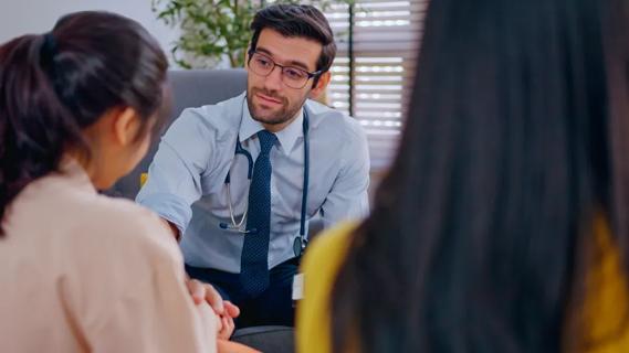 Doctor comforting patient