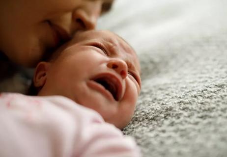 Mother calming her crying baby