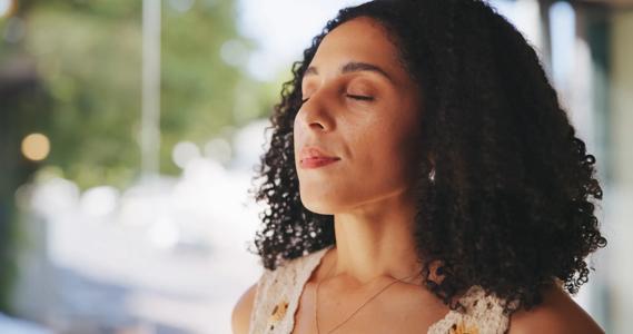 Person with eyes closed, in deep relaxation and concentration