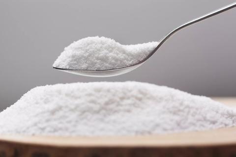 Bowl of artificial sweetener with a spoonful