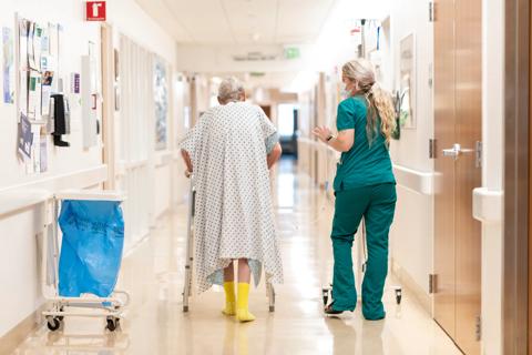 Nurse walking with patient