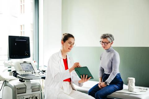 Healthcare provider going over ultrasound results with patient