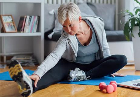 Woman stretches and excercises to control pain from Interstitial Cystitis