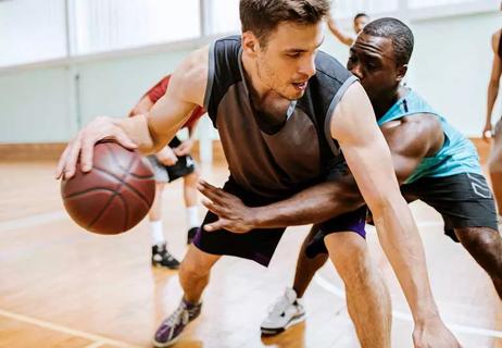 Group of people playing basketball.